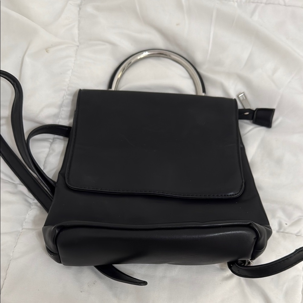 Elegant Black mini backpack. leather.